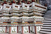 Bangkok Wat Arun - Detail of the indented base of the Phra prang decorated with Chinese ceramic. 